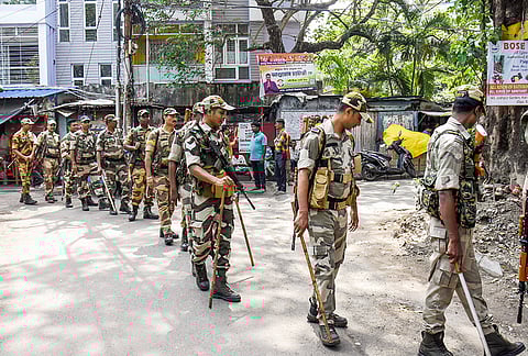 Paramilitary forces conduct march-past and tighten security around Kalighat Kalighat Kali Temple and Rashbehari Assembly constituency during election campaign ahead of West Bengal Assembly polls, in Kolkata.
