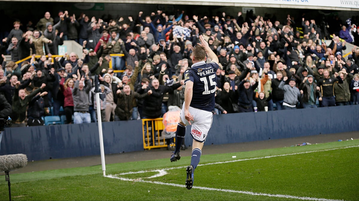 Millwall's Alex Pearce celebrates after scoring a goal during the English FA Cup quarterfinal between Millwall and Brighton & Hove Albion at The Den in London, Sunday March 17, 2018.  - | Photo: AP/Tim Ireland
