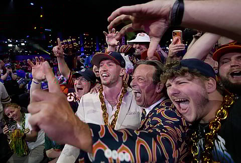 Oregon defensive back Dillon Thieneman celebrates with fans after being chosen by the Chicago Bears with the 25th overall pick during the first round of the NFL football draft, in Pittsburgh.