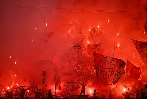 Stuttgart fans set off pyrotechnics before a German Cup semifinal soccer match between VfB Stuttgart and SC Freiburg, in Stuttgart, Germany.