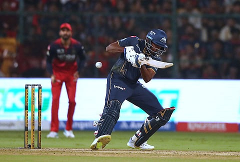Gujarat Titans' Sai Sudharsan hits a boundary during the Indian Premier League cricket match between Royal Challengers Bengaluru and Gujarat Titans in Bengaluru.