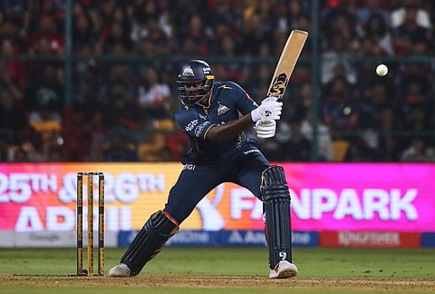 Gujarat Titans' Jason Holder plays a shot during the Indian Premier League cricket match between Royal Challengers Bengaluru and Gujarat Titans in Bengaluru.