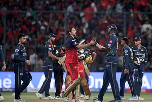 | Photo: AP : Gujarat Titans' Jason Holder congratulates Bengaluru's Tim David after Royal Challengers Bengaluru won against Gujarat Titans during the Indian Premier League cricket match in Bengaluru.