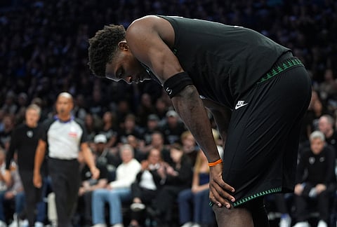 Minnesota Timberwolves guard Anthony Edwards waits for play to resume during the second half in Game 3 of a first-round NBA basketball playoff series against the Denver Nuggets, in Minneapolis. 
