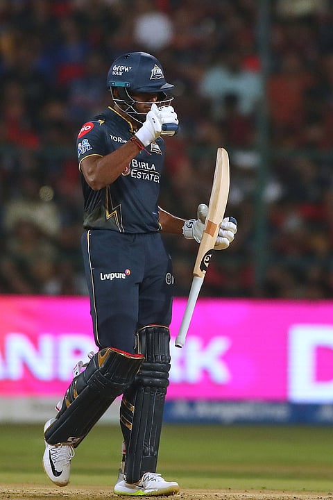 Gujarat Titans' Sai Sudharsan celebrates his fifty runs during the Indian Premier League cricket match between Royal Challengers Bengaluru and Gujarat Titans in Bengaluru.