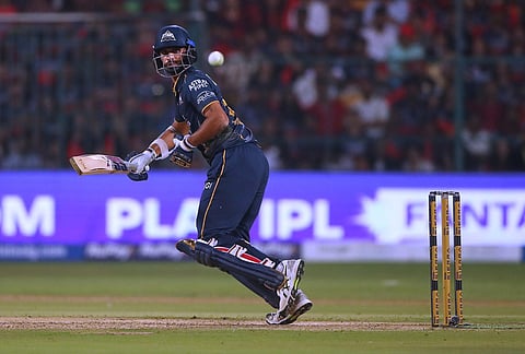 Gujarat Titans' Washington Sundar plays a shot during the Indian Premier League cricket match between Royal Challengers Bengaluru and Gujarat Titans in Bengaluru.