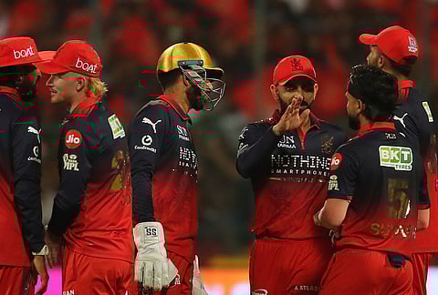 Royal Challengers Bengaluru's Suyash Sharma, second right, celebrates with teammates the wicket of Gujarat Titans' captain Shubman Gill during the Indian Premier League cricket match between Royal Challengers Bengaluru and Gujarat Titans in Bengaluru.