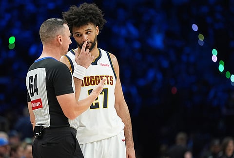 Denver Nuggets guard Jamal Murray (27) talks with referee Justin van Duyne during the second half in Game 3 of a first-round NBA basketball playoff series against the Minnesota Timberwolves, in Minneapolis. 