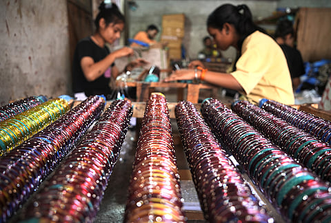 Women are also involved in bangle making and selling. Most are involved in putting decorative stuff on the manufactured bangles. “We get Rs 80 for 100 bangles, and we work from evening to night. Usually, the finished bangles are sent to the markets the same evening. But now, they are just stored here in these boxes,” says one.