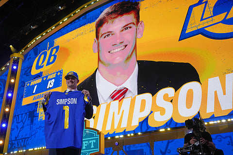 Alabama quarterback Ty Simpson poses after being chosen by the Los Angeles Rams with the 13th overall pick during the first round of the NFL football draft, in Pittsburgh.