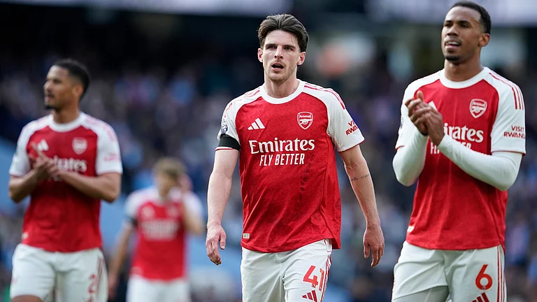 Arsenal's Declan Rice and his teammate Gabriel react at the end of the English Premier League soccer match between Manchester City and and Arsenal, in Manchester, England, Sunday, April 19, 2026. - | Photo: AP/Dave Thompson