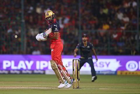 Royal Challengers Bengaluru's Devdutt Padikkal plays a shot during the Indian Premier League cricket match between Royal Challengers Bengaluru and Gujarat Titans in Bengaluru.