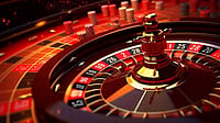 Casino roulette wheel with chips on a red table