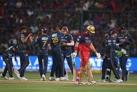 Royal Challengers Bengaluru's Jacob Bethell leaves the ground after losing his wicket during the Indian Premier League cricket match between Royal Challengers Bengaluru and Gujarat Titans in Bengaluru.