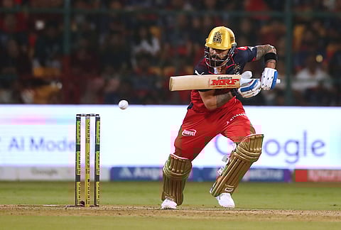 Royal Challengers Bengaluru's Virat Kohli plays a shot during the Indian Premier League cricket match between Royal Challengers Bengaluru and Gujarat Titans in Bengaluru.