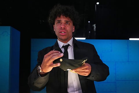 Arizona State wide receiver Jordyn Tyson cries as he looks at his reflection in a mirror while putting on a hat after being chosen by the New Orleans Saints with the eighth overall pick during the first round of the NFL football draft, in Pittsburgh. 