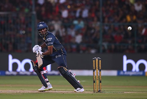 Gujarat Titans' Sai Sudharsan hits a boundary during the Indian Premier League cricket match between Royal Challengers Bengaluru and Gujarat Titans in Bengaluru.
