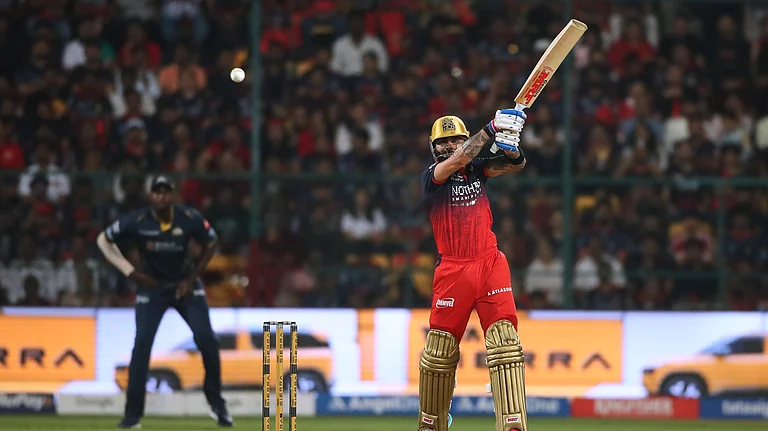 Royal Challengers Bengaluru's Virat Kohli hits a boundary during the Indian Premier League cricket match between Royal Challengers Bengaluru and Gujarat Titans in Bengaluru. - AP Photo