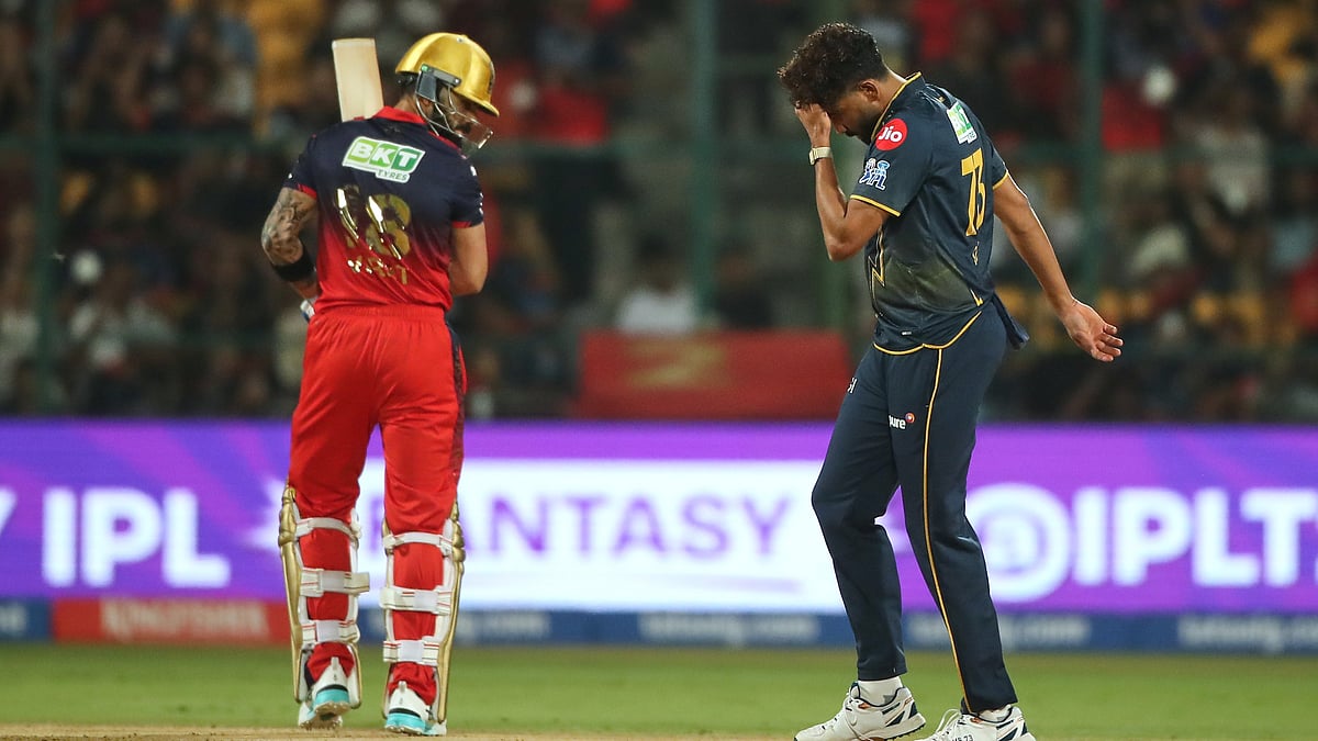 Gujarat Titans' Mohammed Siraj reacts after a catch of Royal Challengers Bengaluru's Virat Kohli, ledt, was dropped during the Indian Premier League cricket match between Royal Challengers Bengaluru and Gujarat Titans in Bengaluru, India, Friday, April 24, 2026. - (AP Photo)
