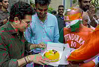 Day In Pics: April 24, 2026 | Photo: AP/Kunal Patil : Mumbai: Cricketer Sachin Tendulkar celebrates his birthday with his fan Sudhir, right, at his residence, in Mumbai.