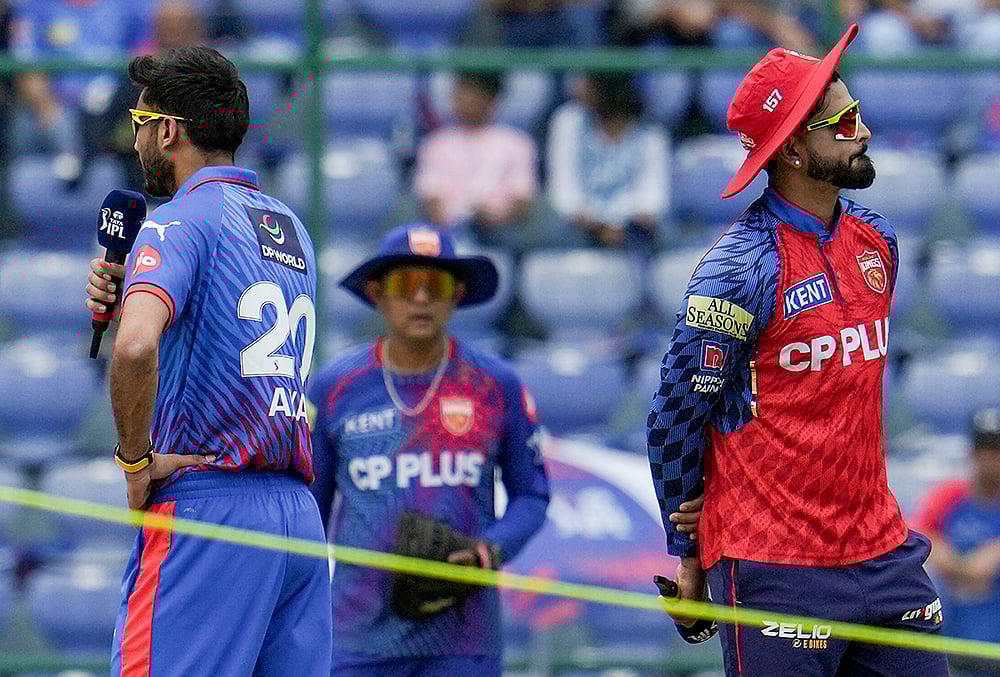 New Delhi: Punjab Kings' captain Shreyas Iyer and Delhi Capitals' captain Axar Patel during the toss before an Indian Premier League (IPL) 2026 T20 cricket match between Punjab Kings and Delhi Capitals, in New Delhi. - | Photo: PTI/Karma Bhutia