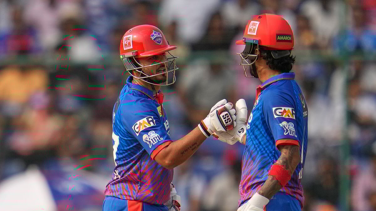 Delhi Capitals' KL Rahul, right, celebrates his fifty runs with batting partner Nitish Rana during the Indian Premier League cricket match between Delhi Capitals and Punjab Kings in New Delhi, India, Saturday, April 25, 2026. - (AP Photo/Manish Swarup)