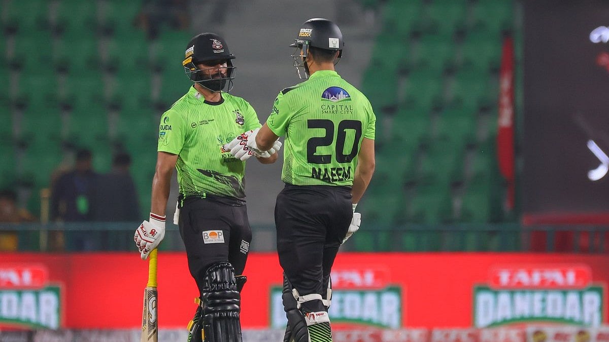 thepslt20/X : Lahore Qalandars cricketers in action against Peshawar Zalmi in PSL 2026 clash at the Gaddafi Stadium in Lahore. 