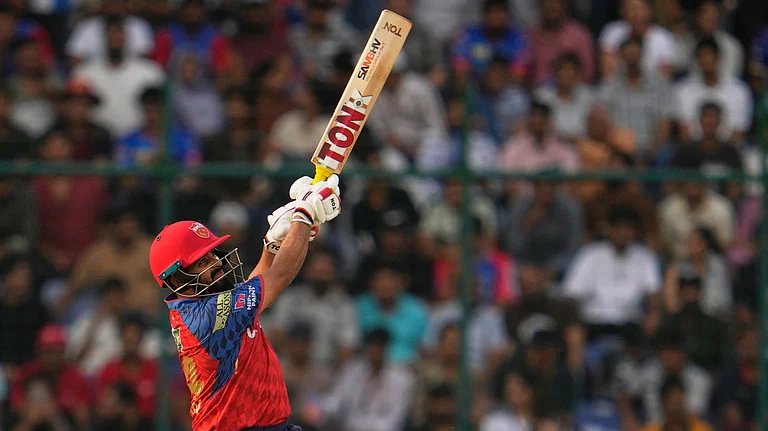 Punjab Kings' Prabhsimran Singh hits a six during the Indian Premier League cricket match between Delhi Capitals and Punjab Kings in New Delhi, India, Saturday, April 25, 2026. - (AP Photo/Manish Swarup)