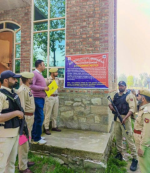 Security personnel during an operation against suspected drug peddlers and attachment of illegally acquired properties, in Srinagar, Jammu and Kashmir. 