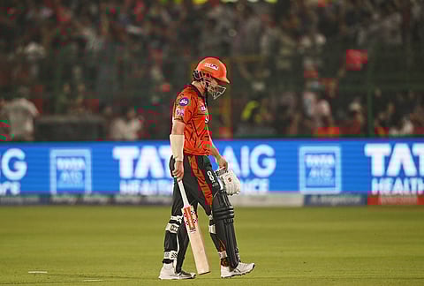 Sunrisers Hyderabad's Travis Head leaves the ground after losing his wicket during the Indian Premier League cricket match between Rajasthan Royals and Sunrisers Hyderabad in Jaipur.