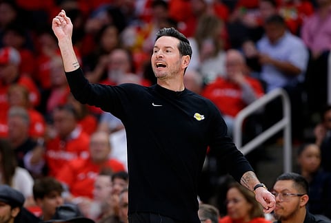 Los Angeles Lakers head coach JJ Redick instructs from the bench during the first half of Game 3 in a first-round NBA playoffs basketball series against the Houston Rockets in Houston. 