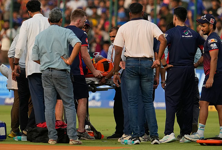 Delhi Capitals' Lungi Ngidi is carried on a stretcher after he was injured during the Indian Premier League cricket match between Delhi Capitals and Punjab Kings in New Delhi. - | Photo: AP/Manish Swarup