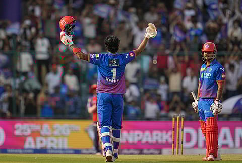 Delhi Capitals' KL Rahul celebrates his century as Nitish Rana, right, looks during the Indian Premier League cricket match between Delhi Capitals and Punjab Kings in New Delhi.