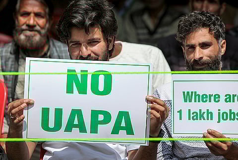 People gather during a workers' convention organised by People’s Democratic Party (PDP) Chief Mehbooba Mufti, unseen, at Dak Bungalow, in Anantnag, Jammu and Kashmir.