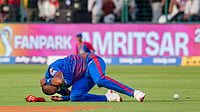 | Photo: PTI/Karma Bhutia : Delhi Capitals' Lungi Ngidi reacts to an injury during the Indian Premier League (IPL) 2026 T20 cricket match between Delhi Capitals and Punjab Kings, in New Delhi.