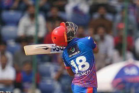 Delhi Capitals' Pathum Nissanka watches the ball after playing it in the air during the Indian Premier League cricket match between Delhi Capitals and Punjab Kings in Delhi.