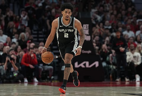 San Antonio Spurs guard Dylan Harper (2) drives against the Portland Trail Blazers during the second half in Game 3 of a first-round NBA playoffs basketball series in Portland, Oregon.
