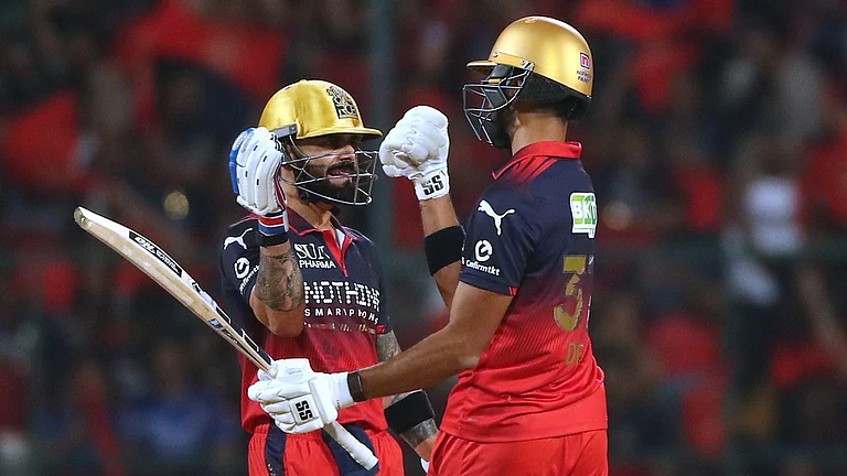 Royal Challengers Bengaluru's Virat Kohli celebrates his fifty runs with batting partner Devdutt Padikkal during the Indian Premier League cricket match between Royal Challengers Bengaluru and Gujarat Titans in Bengaluru, India, Friday, April 24, 2026. - AP Photo