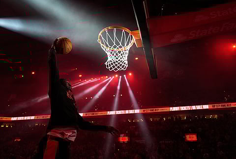 Portland Trail Blazers guard Sidy Cissoko warms up before Game 3 of a first-round NBA playoffs basketball series against the San Antonio Spurs in Portland, Oregon.