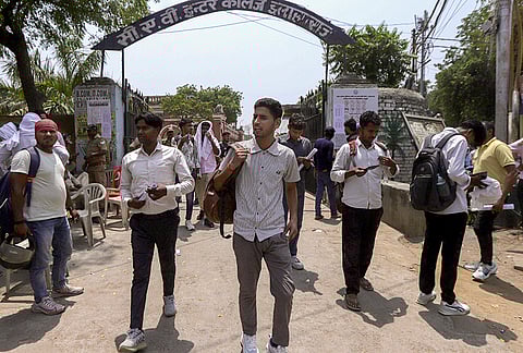 Candidates leave after appearing for Uttar Pradesh Home Guard exam 2026 conducted by UP Police Recruitment and Promotion Board (UPPRPB), at an examination centre, in Prayagraj.