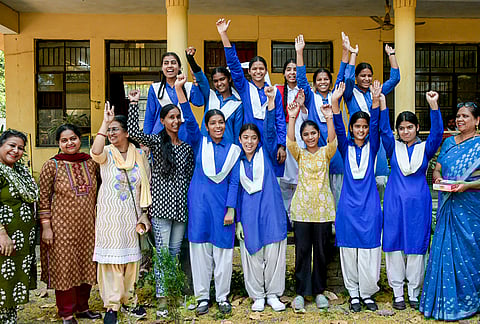 Students celebrate after the declaration of Uttarakhand Board of School Education (UBSE) Class 10th and Class 12th results, in Dehradun.
