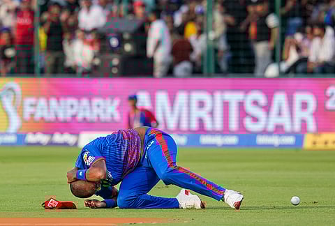 Delhi Capitals' Lungi Ngidi reacts to an injury during the Indian Premier League (IPL) 2026 T20 cricket match between Delhi Capitals and Punjab Kings, in New Delhi.
