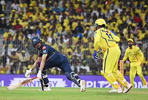Gujarat Titans' captain Shubman Gill reacts after being stumped out by Chennai Super Kings' Sanju Samson, center, during the Indian Premier League cricket match between Chennai Super Kings and Gujarat Titans in Chennai.