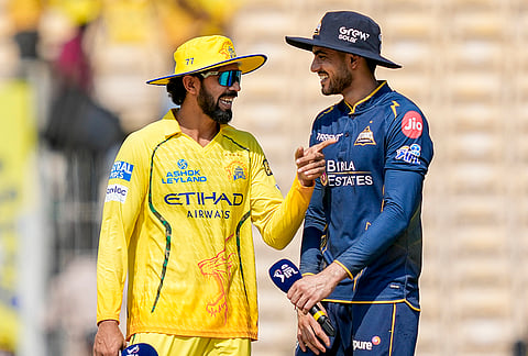 Chennai Super Kings’ captain Ruturaj Gaikwad, left, and Gujarat Giants’ captain Shubman Gill during the toss before an Indian Premier League (IPL) T20 cricket match between Chennai Super Kings and Gujarat Titans, in Chennai, Tamil Nadu.