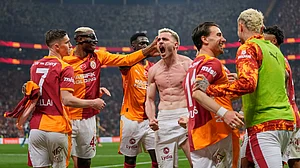 AP Photo : Galatasaray's Baris Yilmaz, center, celebrates with teammates after scoring his side's second goal during a Turkish Super Lig soccer match between Galatasaray and Fenerbahce in Istanbul, Turkey, Sunday.