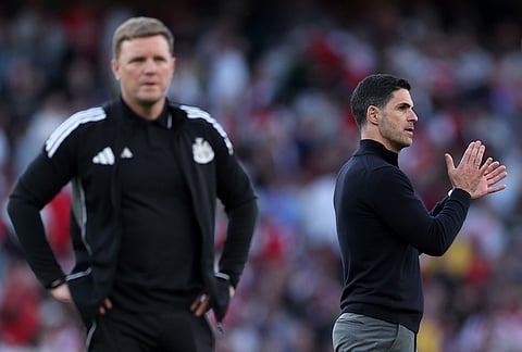 Arsenal's manager Mikel Arteta, right, and Newcastle's head coach Eddie Howe react at the end the English Premier League soccer match between Arsenal and Newcastle United in London.