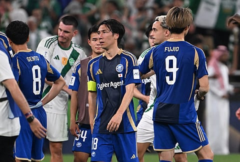 Machida Zelvia players walk off the field after losing after against Al-Ahli in the Champions League Elite soccer match in Jeddah, Saudi Arabia.