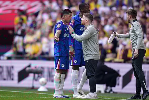 Chelsea's interim manager Calum McFarlane speaks with Chelsea's Enzo Fernandez during the FA Cup semifinal soccer match between Chelsea and Leeds in London, England.