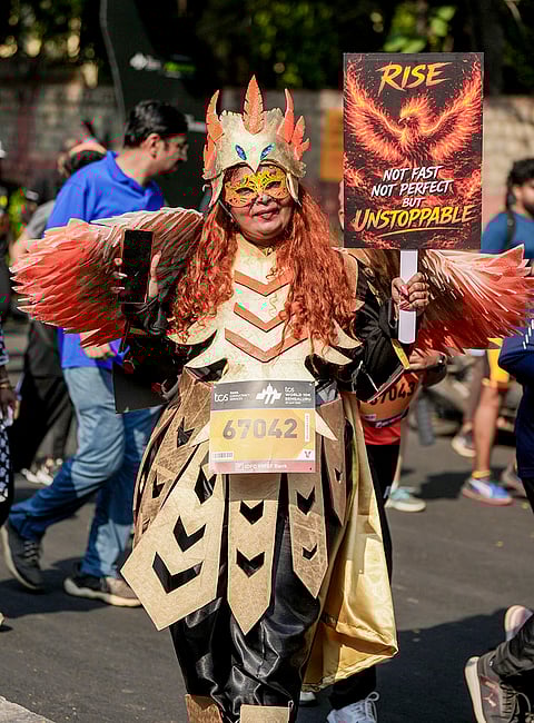 A woman dressed as a phoenix takes part in the TCS World 10K marathon, in Bengaluru.