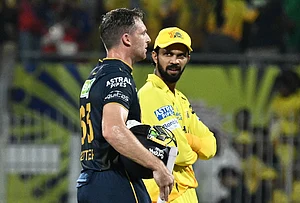 | Photo: AP : Gujarat Titans' Jos Buttler, left, walks with Chennai Super Kings' captain Ruturaj Gaikwad after Gujarat Titans won the Premier League cricket match against Chennai Super Kings in Chennai.